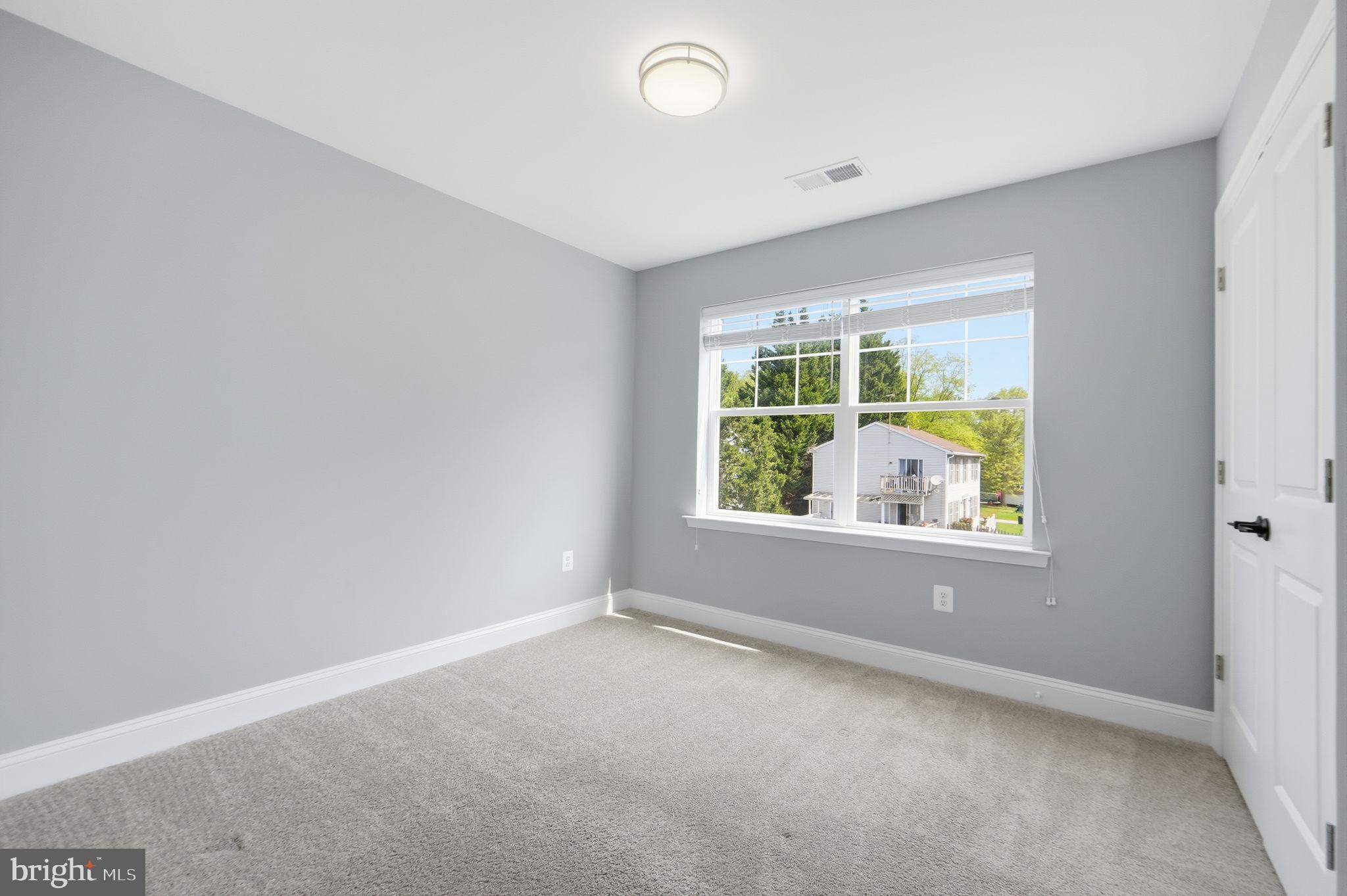 14309 Drayton Avenue Silver Spring, MD 20904 - Photo 28 of 44 an empty room with windows