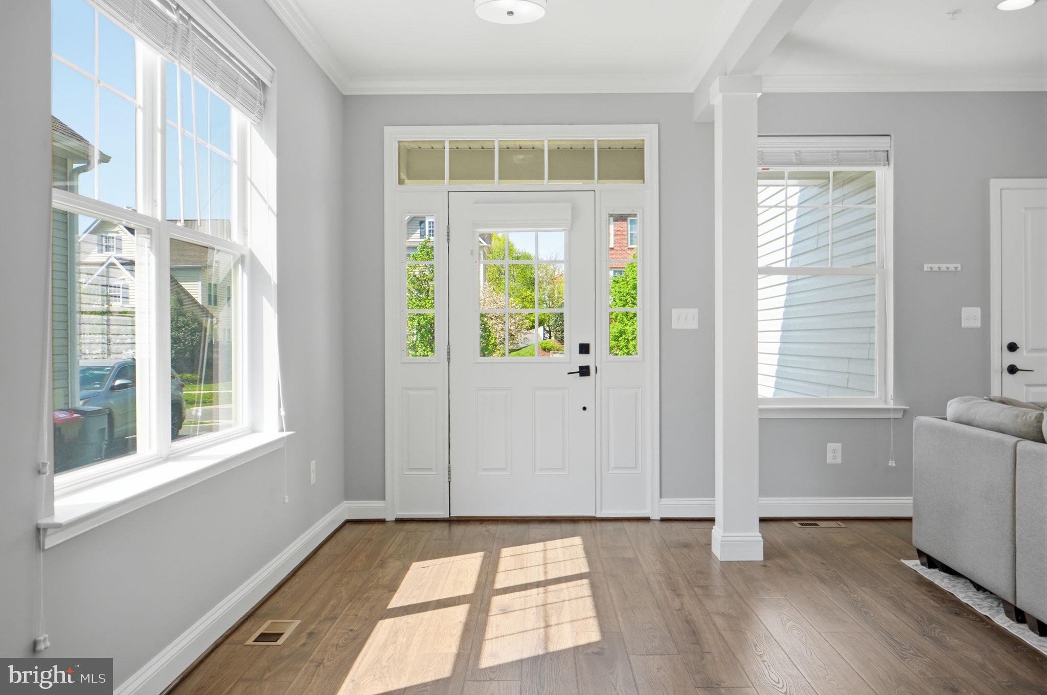 14309 Drayton Avenue Silver Spring, MD 20904 - Photo 8 of 44 a view of an entryway with wooden floor and windows