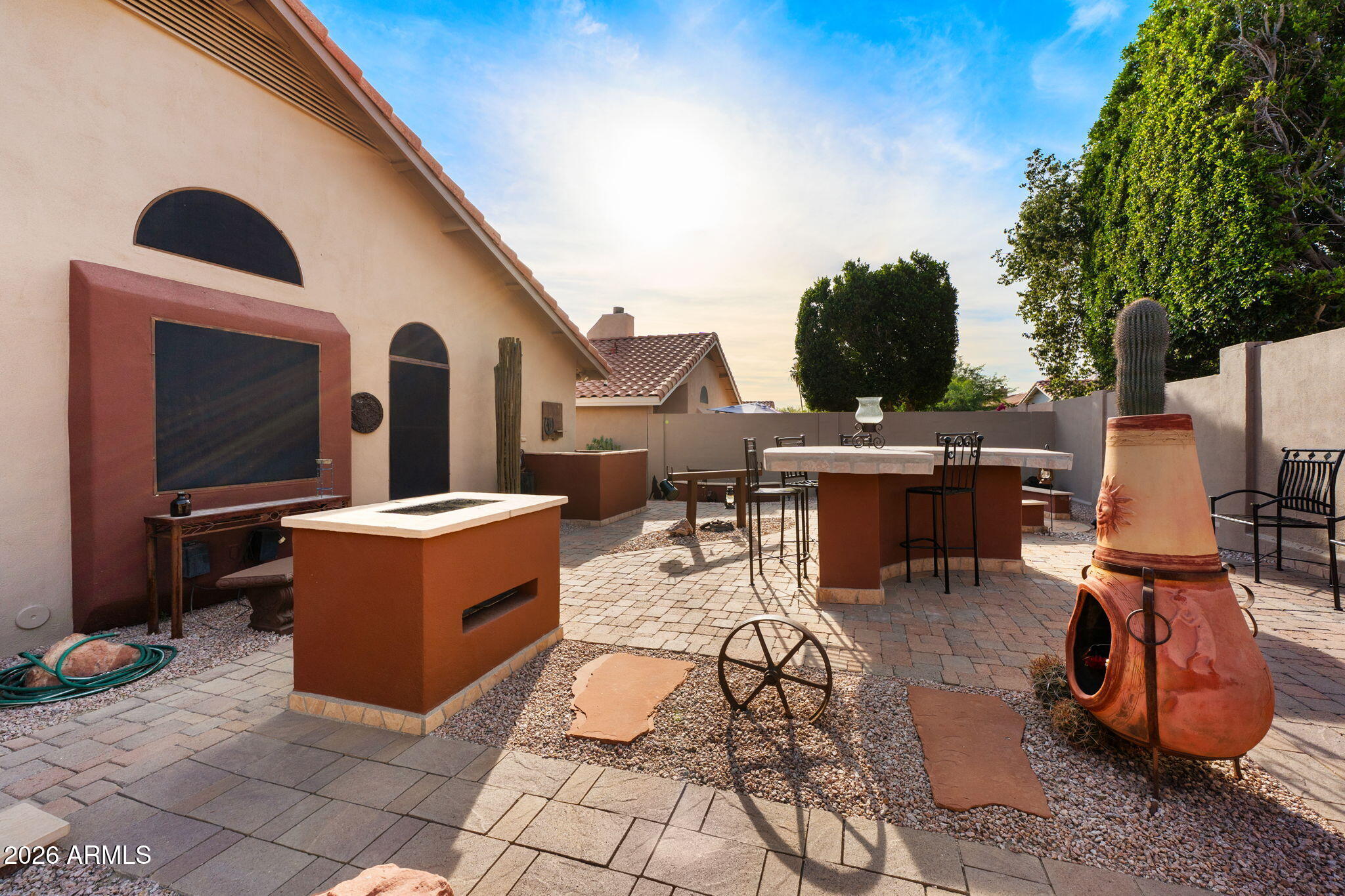 6526 East Raftriver Street Mesa, AZ 85215 - Photo 15 of 17 a view of a patio with chairs and tables
