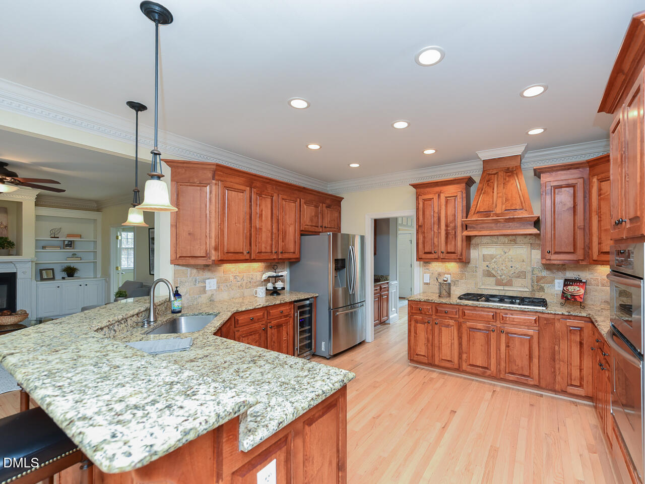 7108 Millstone Ridge Court Raleigh, NC 27614 - Photo 12 of 50 a kitchen with stainless steel appliances granite countertop sink stove refrigerator and cabinets