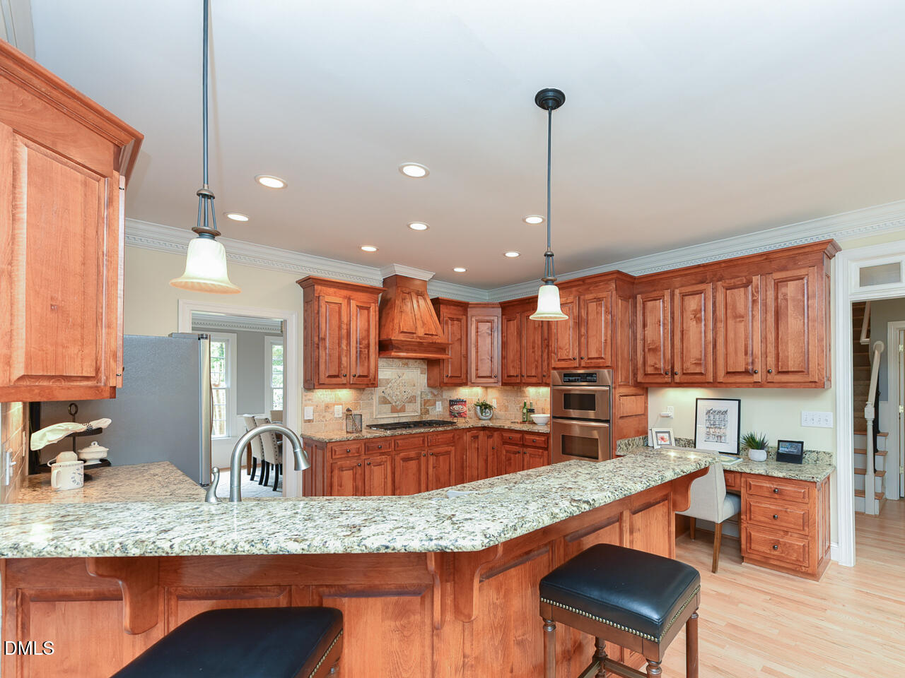 7108 Millstone Ridge Court Raleigh, NC 27614 - Photo 15 of 50 a kitchen with granite countertop counter top space cabinets and stainless steel appliances