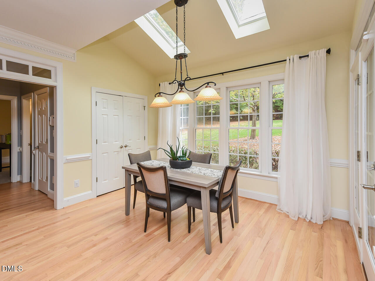7108 Millstone Ridge Court Raleigh, NC 27614 - Photo 17 of 50 a view of a dining room with furniture window and wooden floor