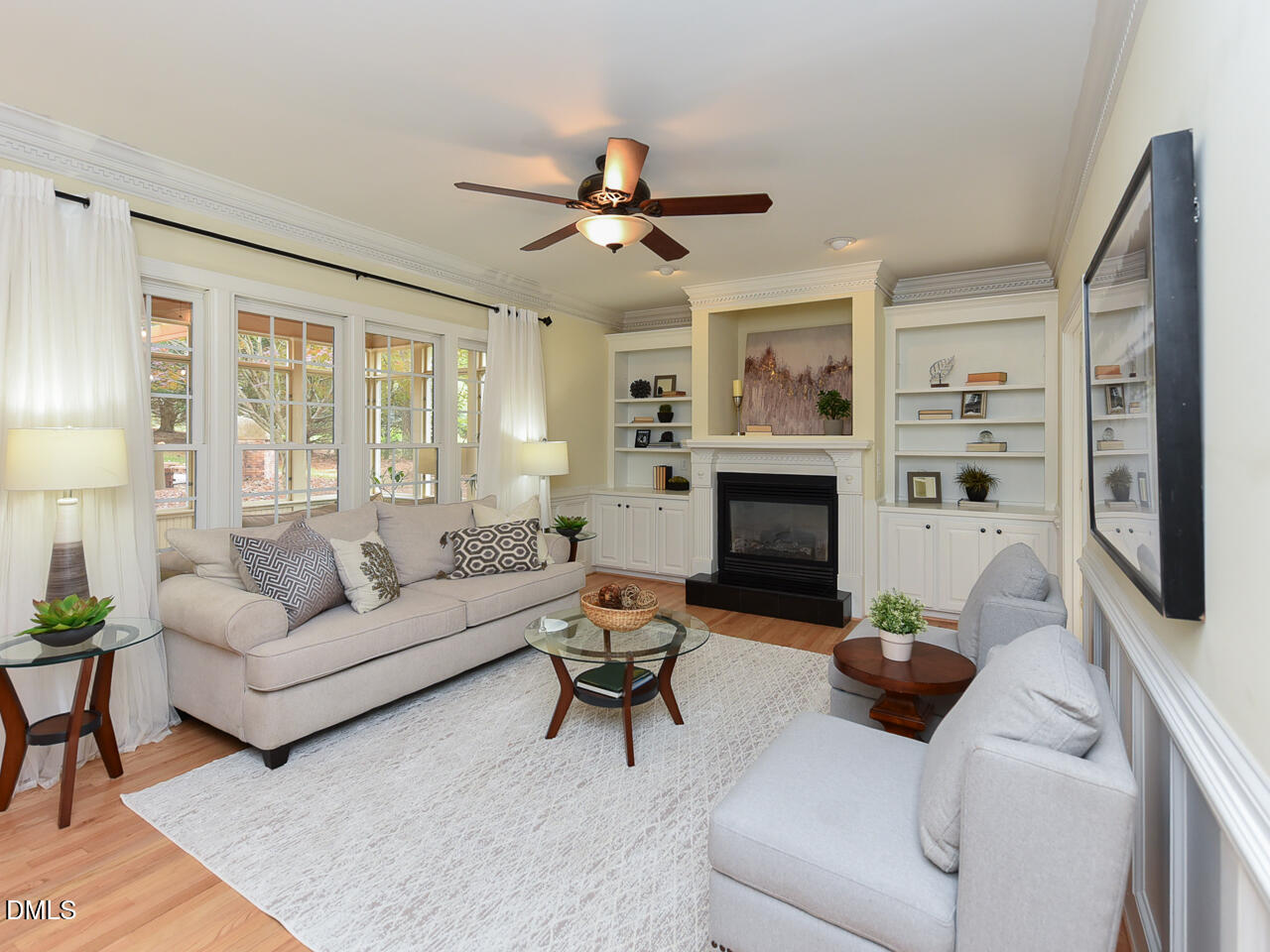 7108 Millstone Ridge Court Raleigh, NC 27614 - Photo 22 of 50 a living room with furniture a flat screen tv and a fireplace