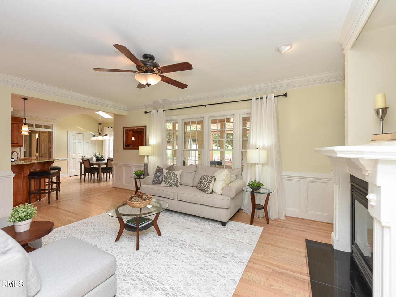 7108 Millstone Ridge Court Raleigh, NC 27614 - Photo 23 of 50 a living room with furniture a fireplace and a table