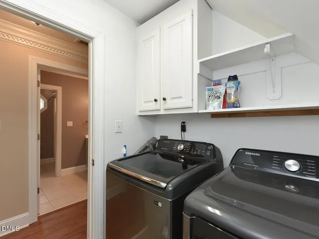 a view of kitchen with cabinets