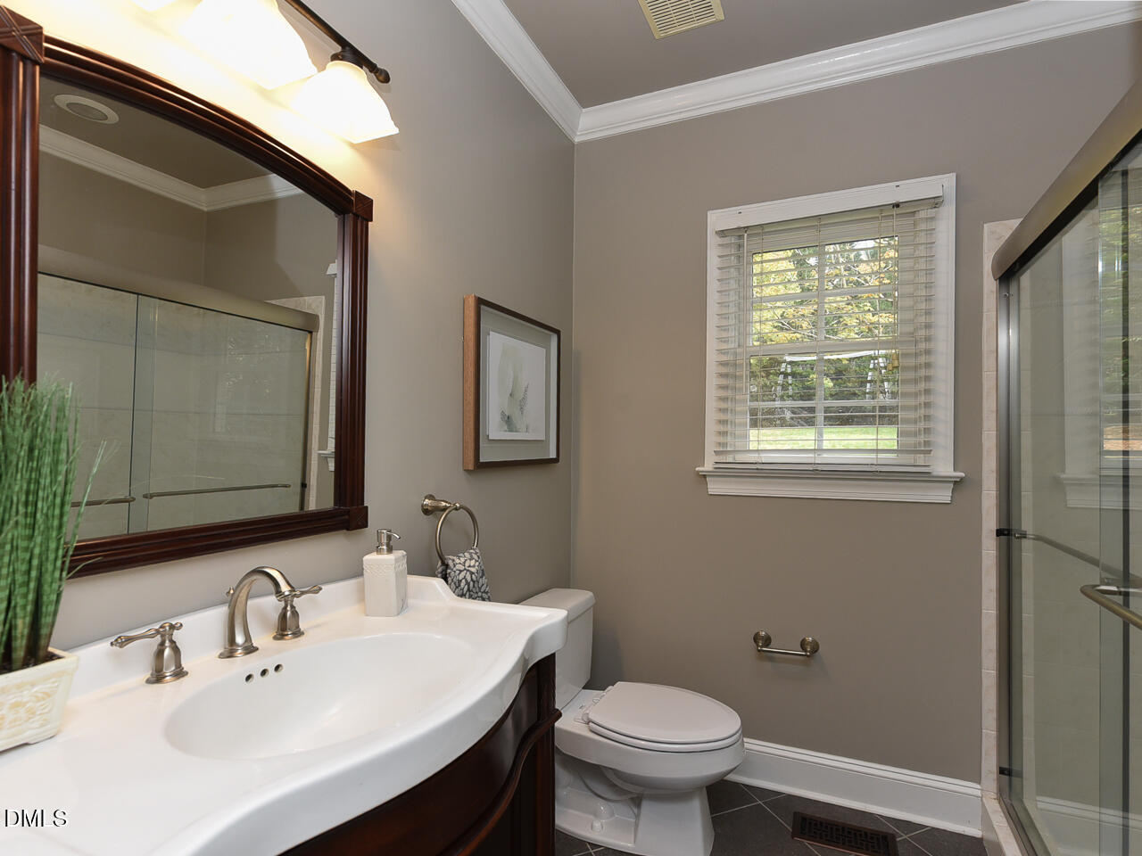 7108 Millstone Ridge Court Raleigh, NC 27614 - Photo 26 of 50 a bathroom with a sink a toilet and mirror