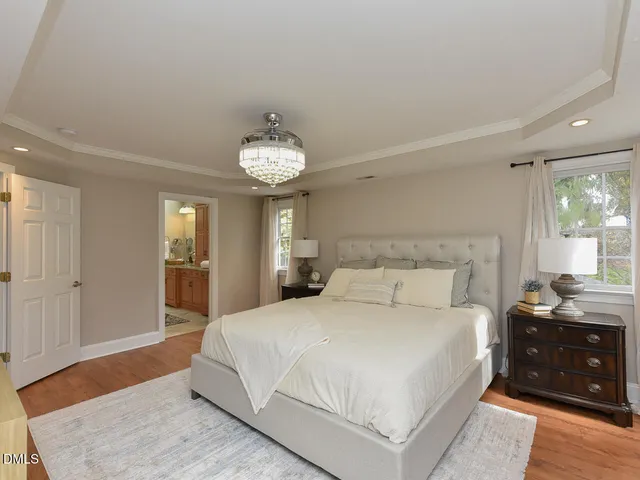 a spacious bathroom with a granite countertop sink and a mirror