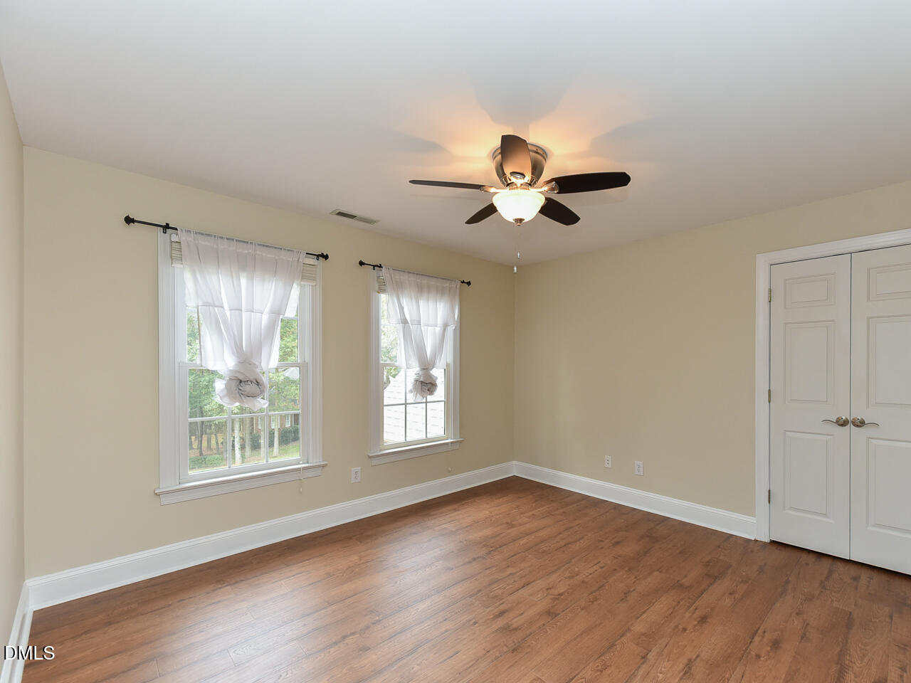 7108 Millstone Ridge Court Raleigh, NC 27614 - Photo 35 of 50 an empty room with wooden floor and windows