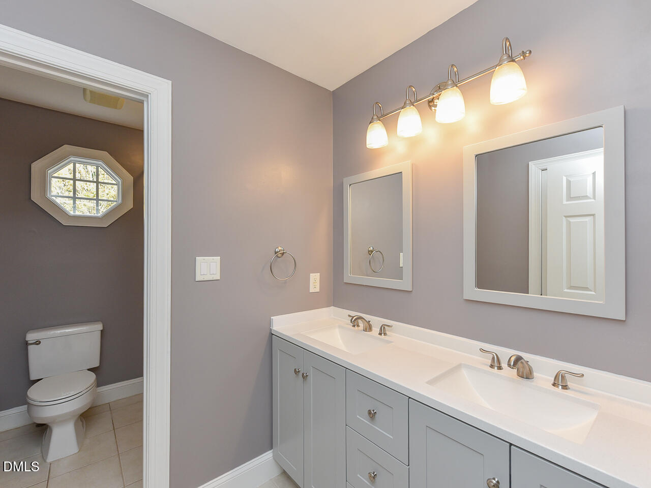 7108 Millstone Ridge Court Raleigh, NC 27614 - Photo 36 of 50 a bathroom with a toilet sink and mirror