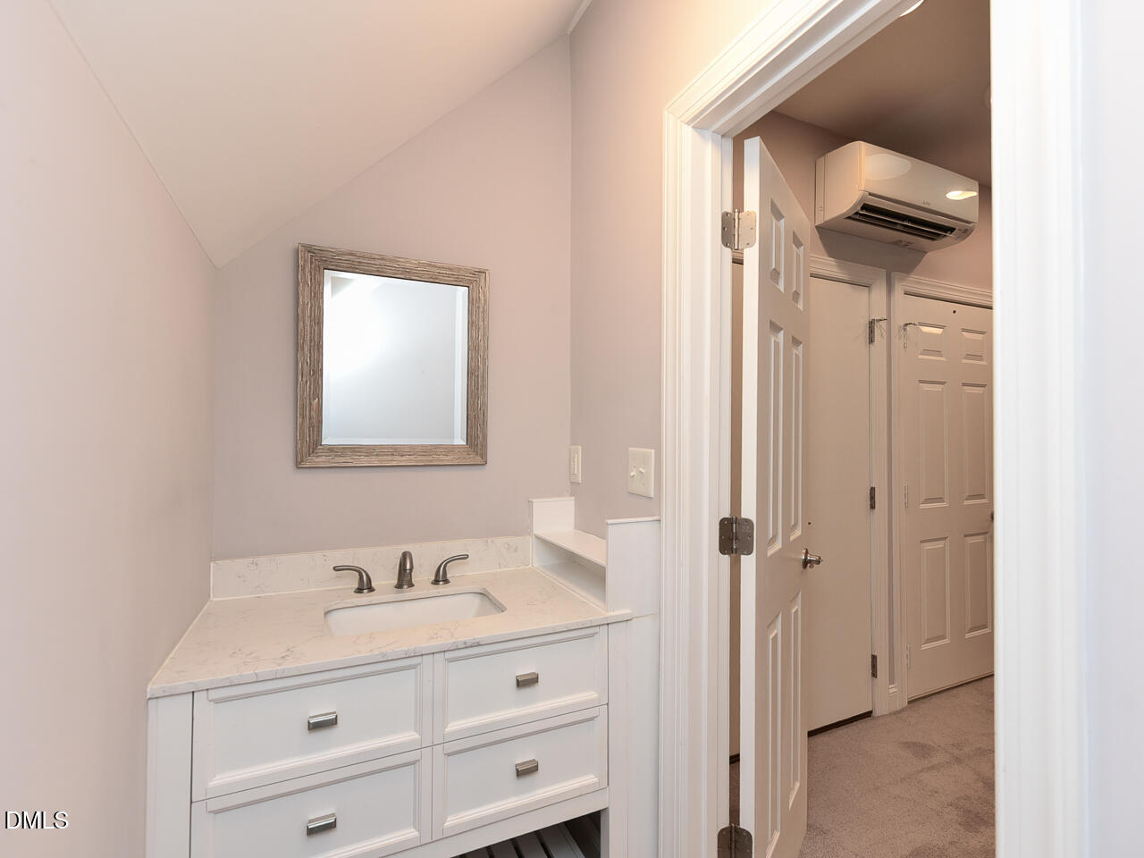 7108 Millstone Ridge Court Raleigh, NC 27614 - Photo 40 of 50 a bathroom with a sink and a mirror