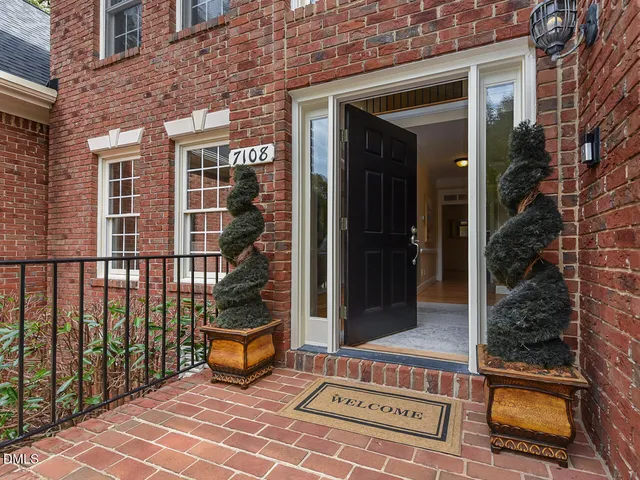 a view of a balcony with chair and wooden floor