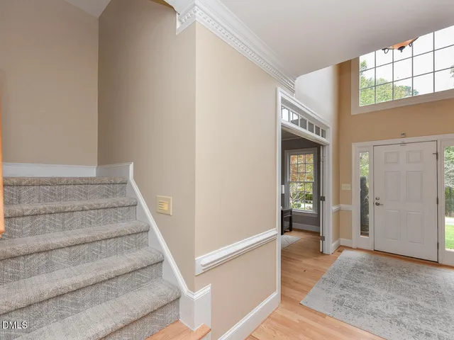 a view of staircase with white walls and windows