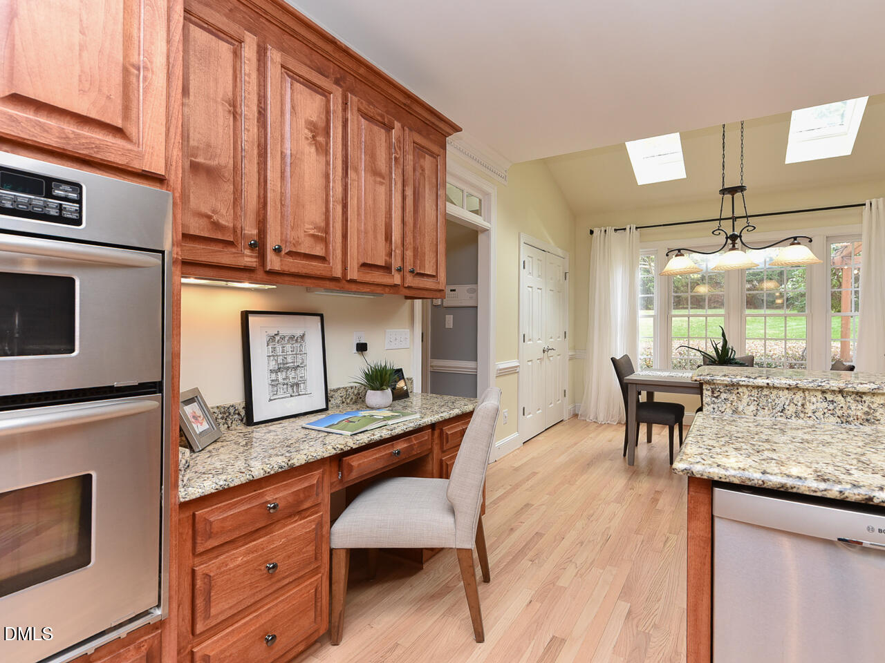 7108 Millstone Ridge Court Raleigh, NC 27614 - Photo 10 of 50 a kitchen with granite countertop a stove and cabinets