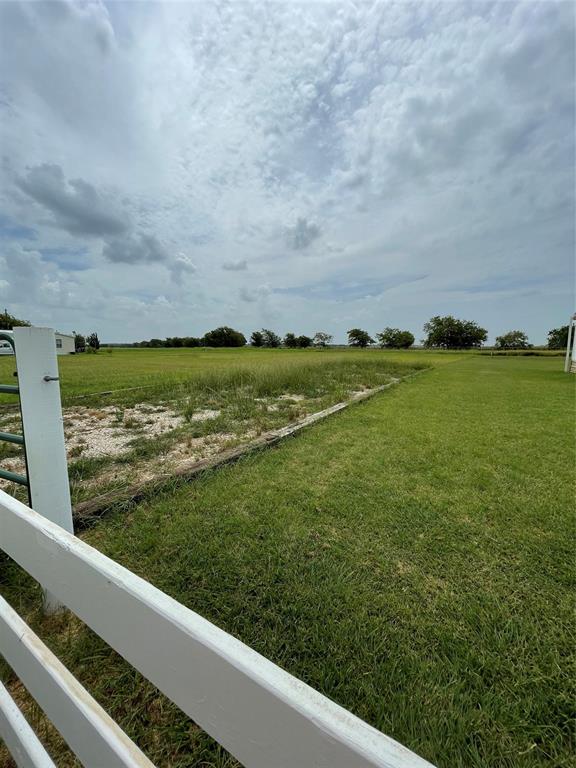 Tbd Chad Avenue Whitney, TX 76692 - Photo 3 of 3 a view of a green field of grass and an ocean view