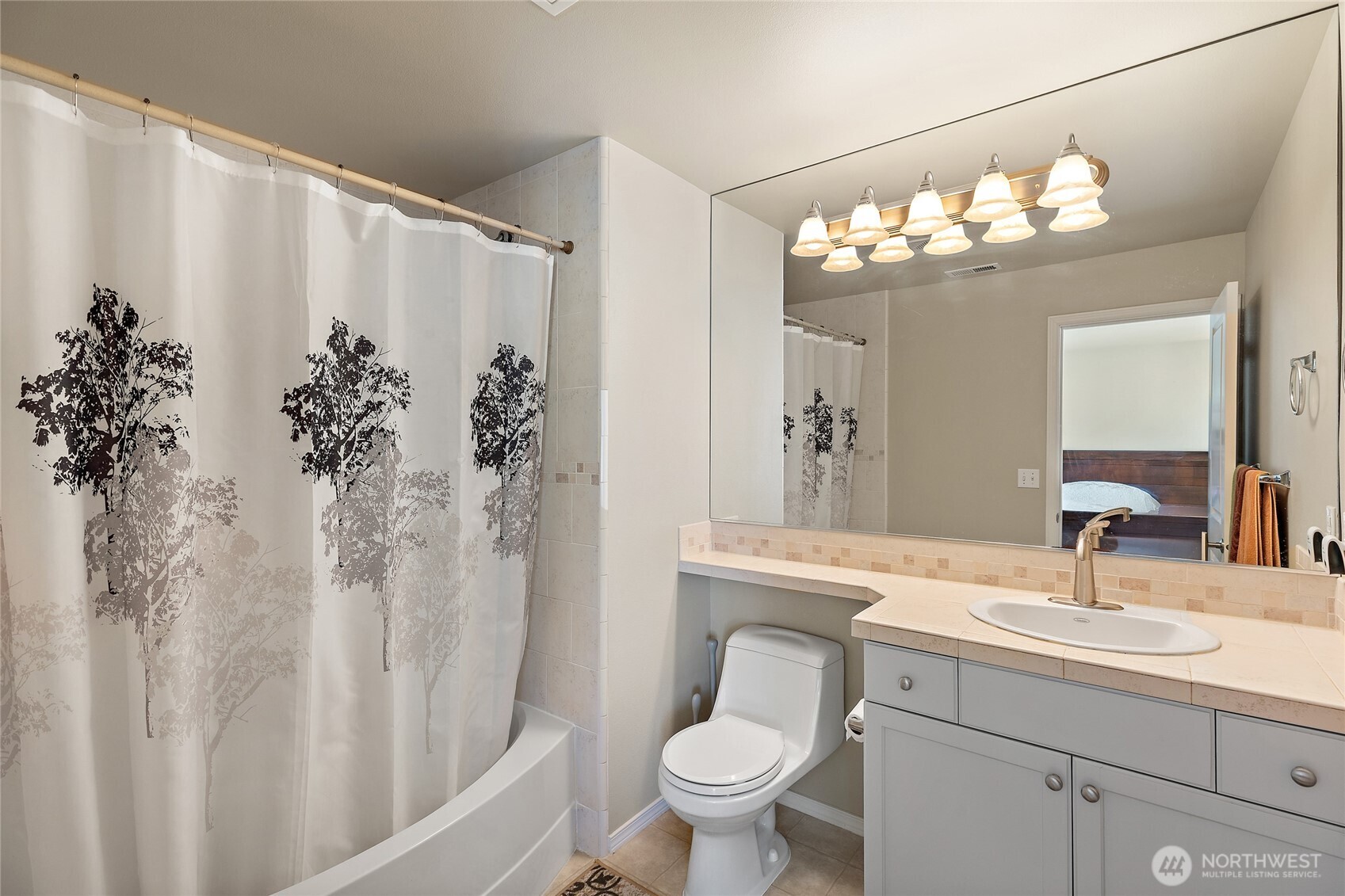 442 Tacoma Place Northeast Renton, WA 98056 - Photo 15 of 17 a bathroom with a sink toilet and shower