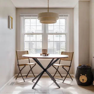 a dining room with furniture and window