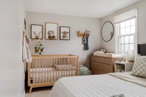 a bedroom with a bed and a dresser