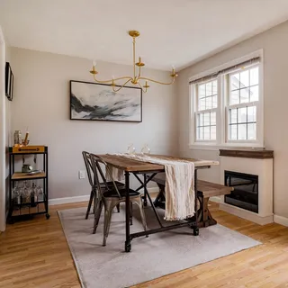 a view of a livingroom with furniture and a fireplace