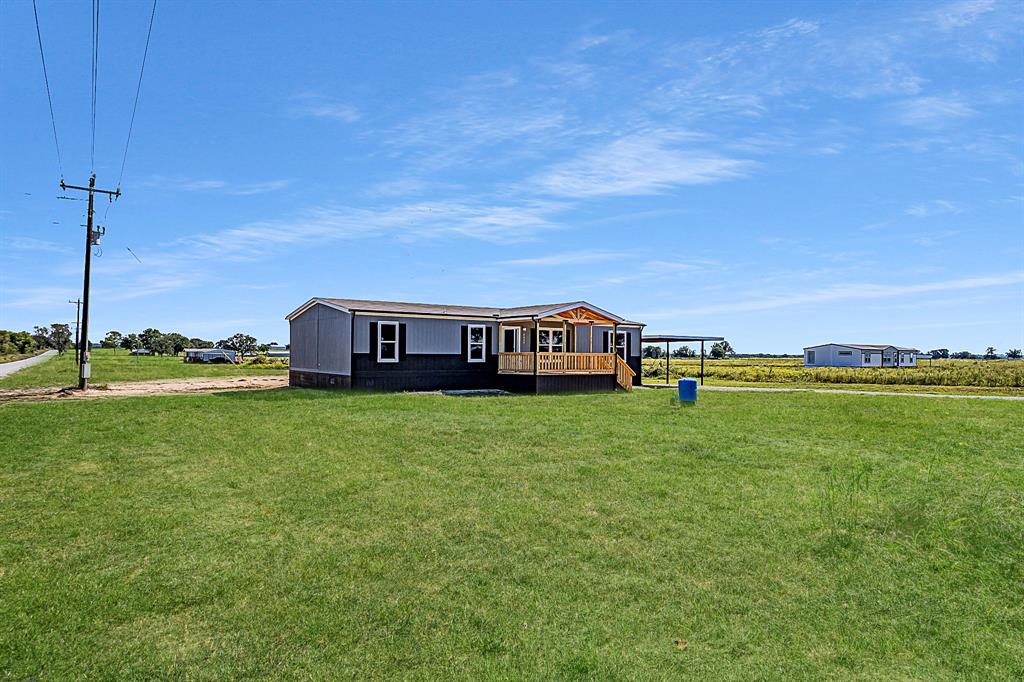 a view of a house with a big yard