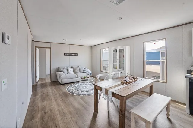 a view of a livingroom with furniture and window
