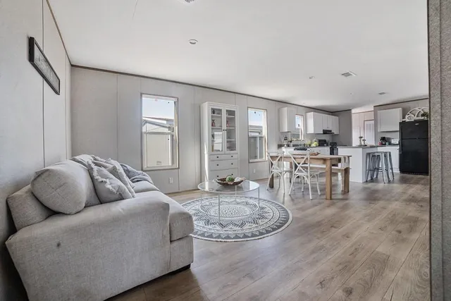a living room with furniture and a table