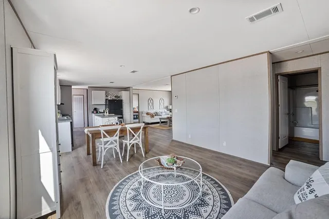 a living room with furniture and a table
