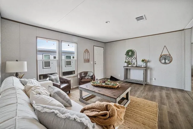 a living room with furniture and a table