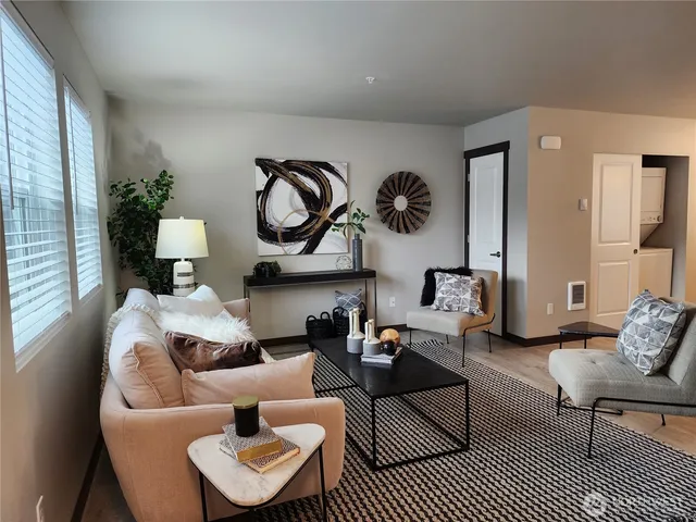 a living room with furniture and a rug