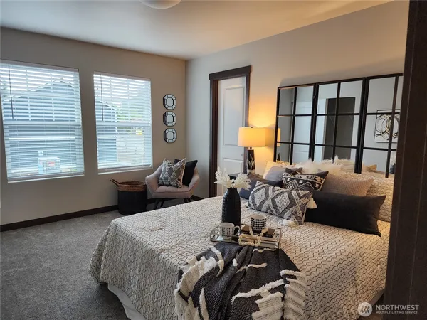 a bedroom with furniture and a window