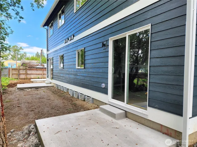 a view of a brick house with a large window