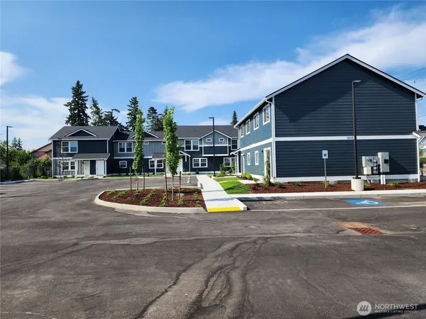 a view of pool with a yard