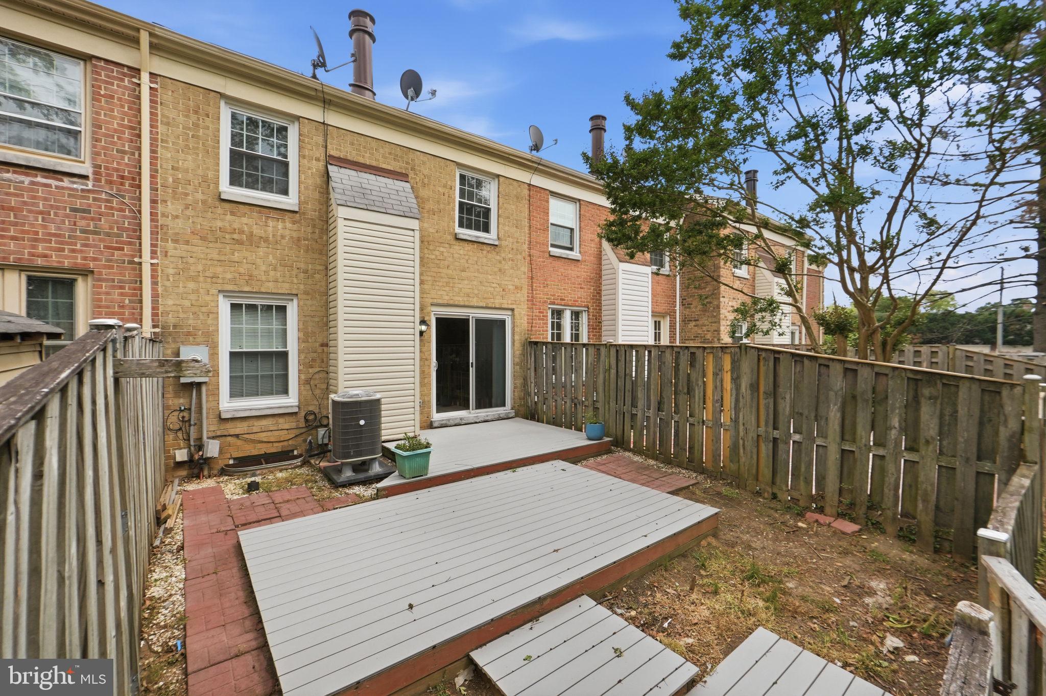 6470 Franconia Court Springfield, VA 22150 - Photo 26 of 31 front view of a house with a wooden fence