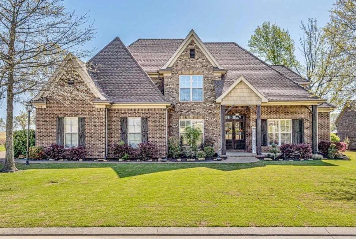 a front view of a house with swimming pool