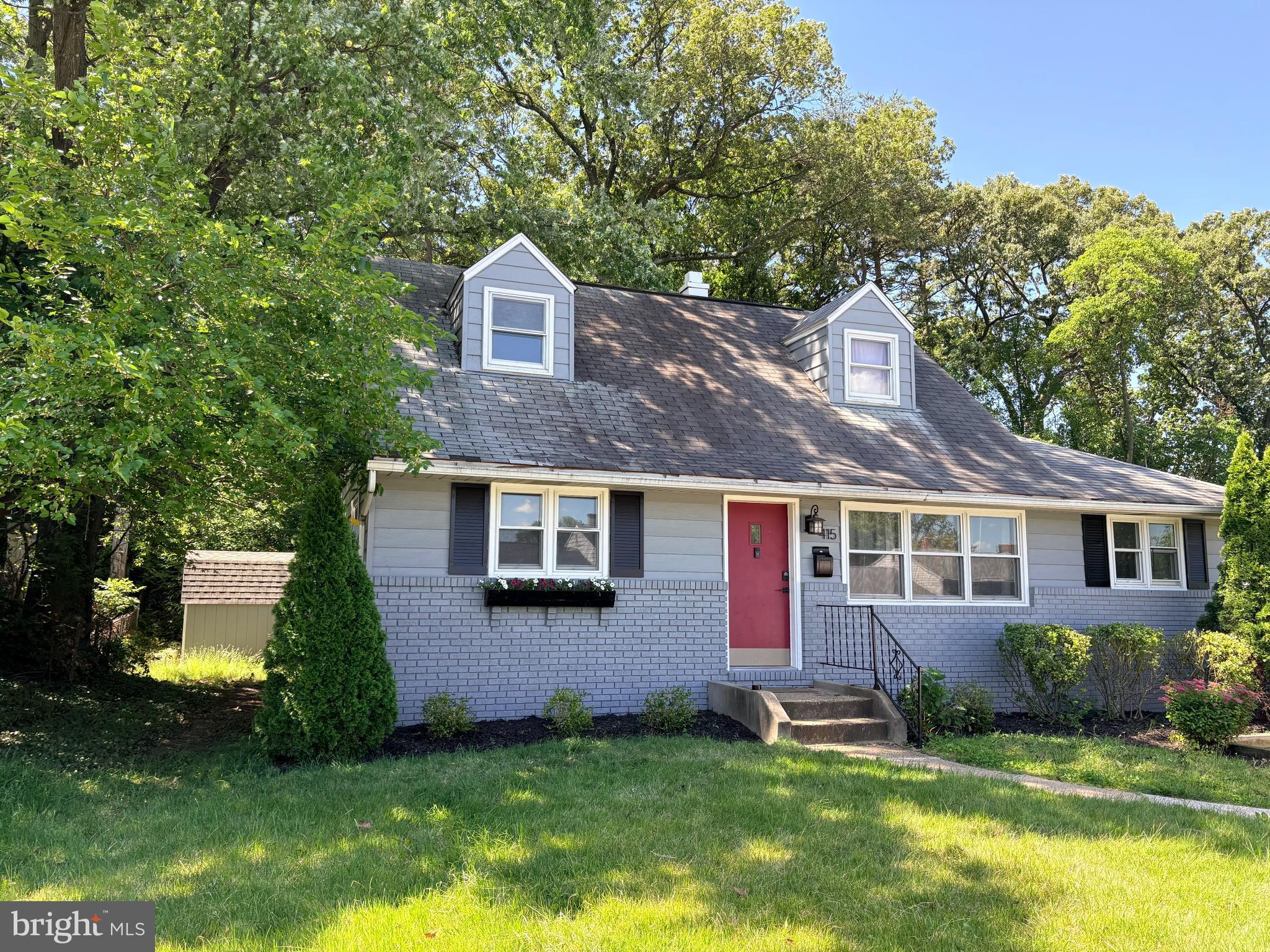 415 Baylor Road Glen Burnie, MD 21061 - Photo 1 of 29 a front view of a house with a yard and garage