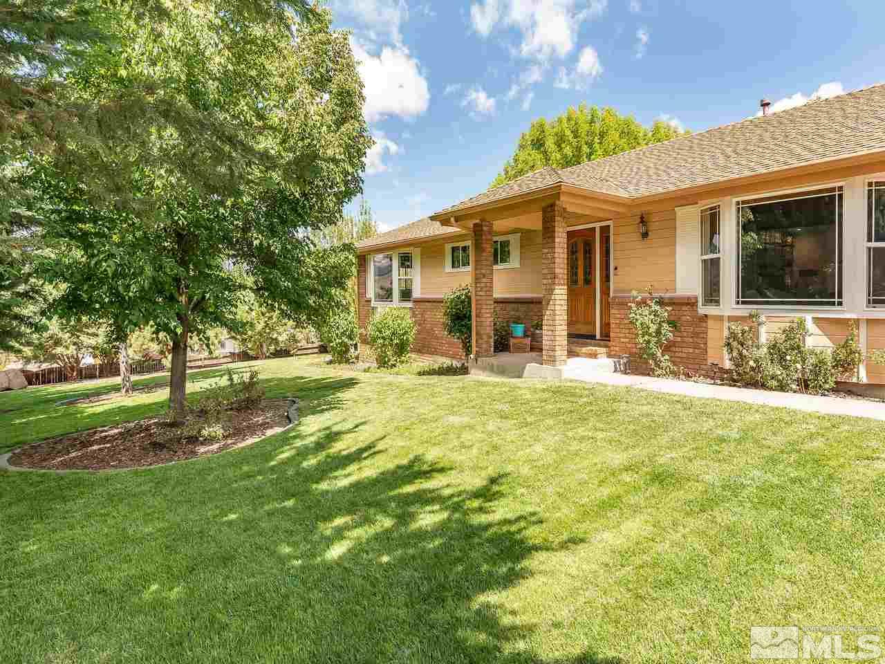 14420 Rim Rock Drive Reno, NV 89521 - Photo 3 of 26 a view of a house with a yard
