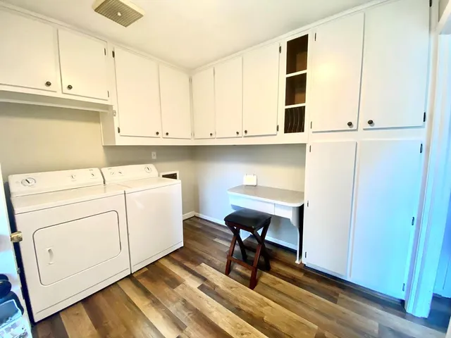 a view of kitchen with sink and cabinets