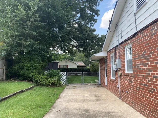 a backyard of a house with garden