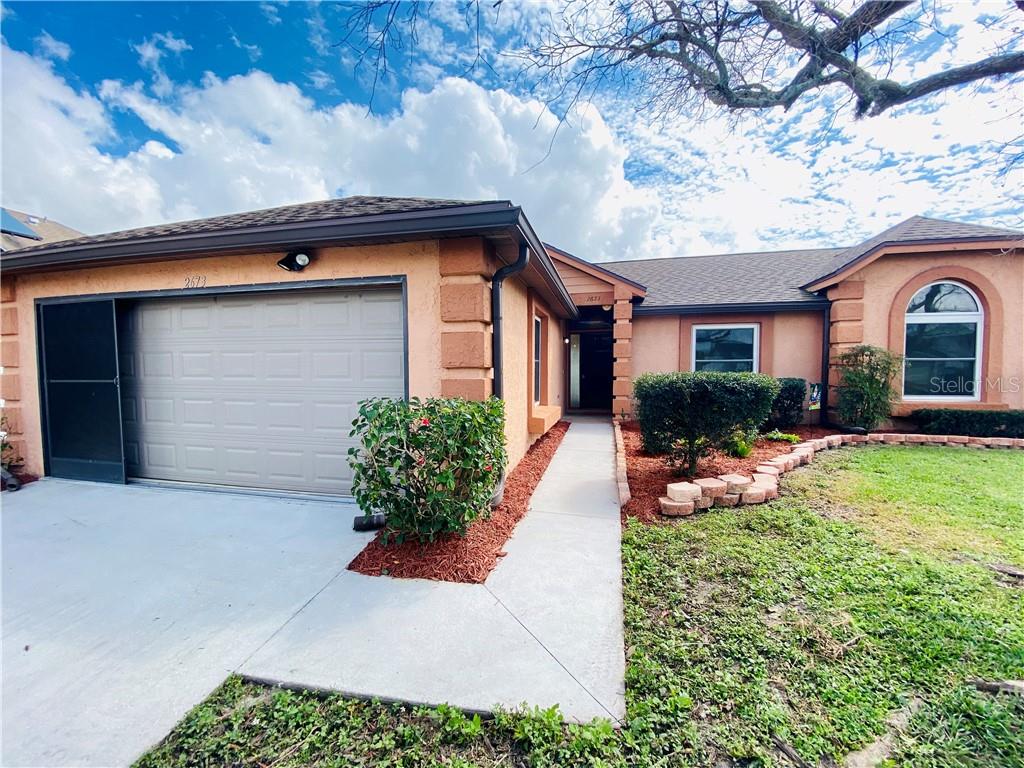 2673 Debany Road Kissimmee, FL 34744 - Photo 1 of 1 a front view of a house with garden