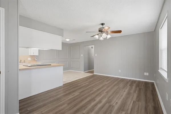 a view of kitchen with granite countertop cabinets a sink and dishwasher