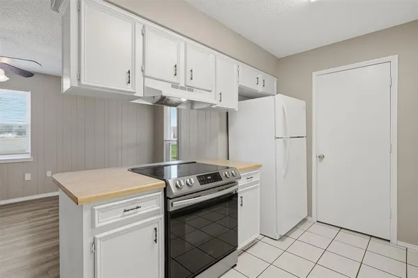 a kitchen with appliances and cabinets