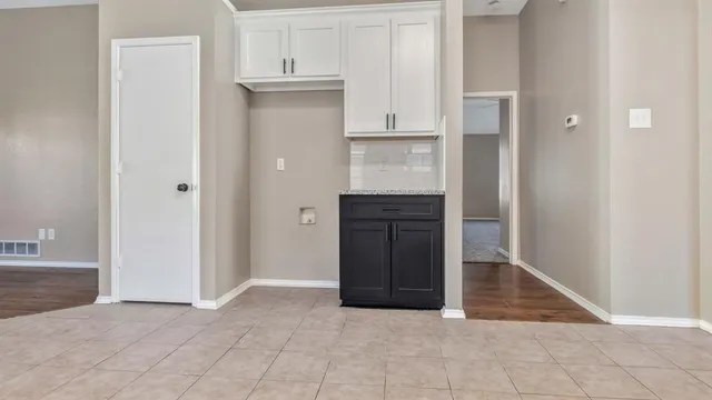 a view of kitchen and front door