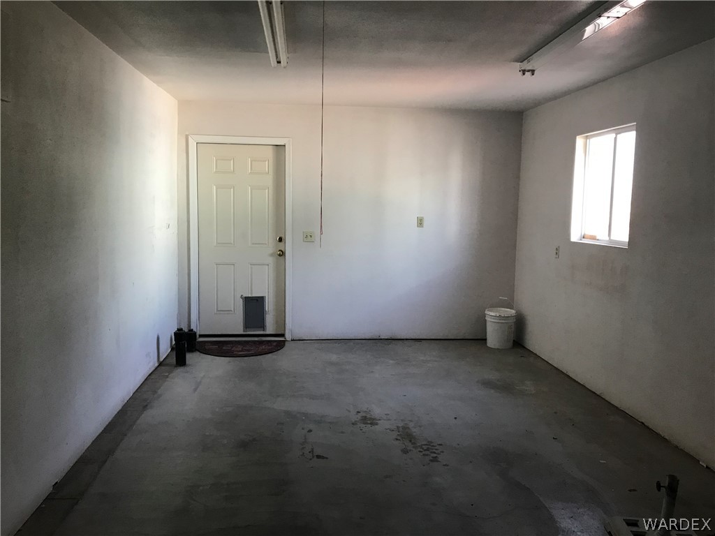 2066 East El Rodeo Road, Unit 5 Fort Mohave, AZ 86426 - Photo 33 of 34 Garage - door exits to back yard - Electric garage door opening.