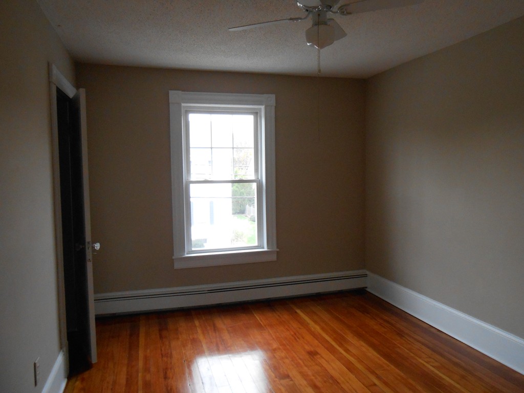 20 Lawrence Road Chicopee, MA 01013 - Photo 13 of 20 an empty room with wooden floor and a window