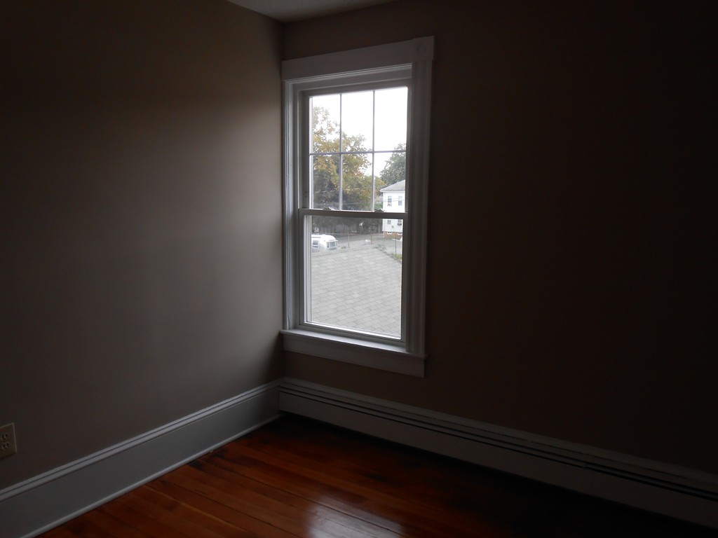 20 Lawrence Road Chicopee, MA 01013 - Photo 16 of 20 a view of an empty room with wooden floor and a window