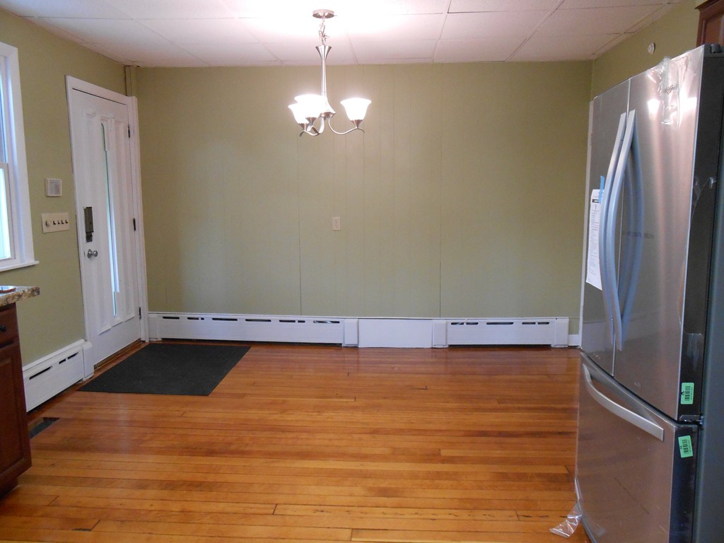 20 Lawrence Road Chicopee, MA 01013 - Photo 6 of 20 a view of room with kitchen chandelier and wooden floor