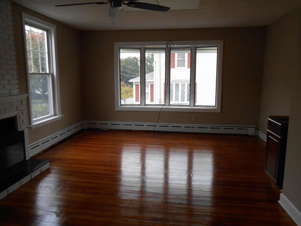 20 Lawrence Road Chicopee, MA 01013 - Photo 10 of 20 a view of empty room with wooden floor and fan