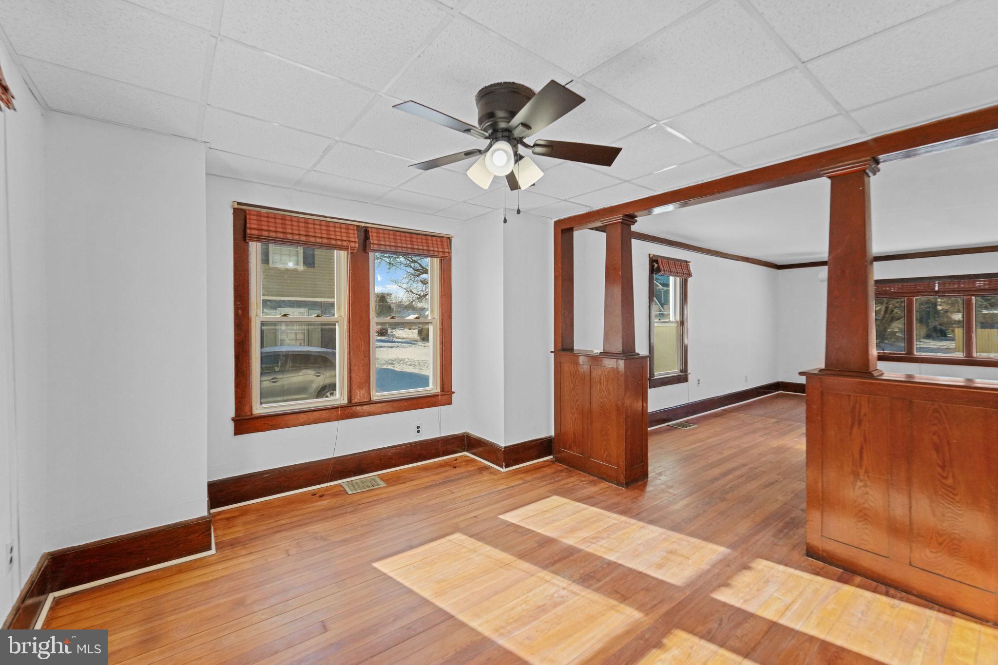 200 Union Street Salem, NJ 08079 - Photo 12 of 43 a view of an empty room with window and wooden floor