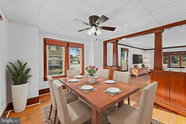 a view of a dining room with furniture window and wooden floor