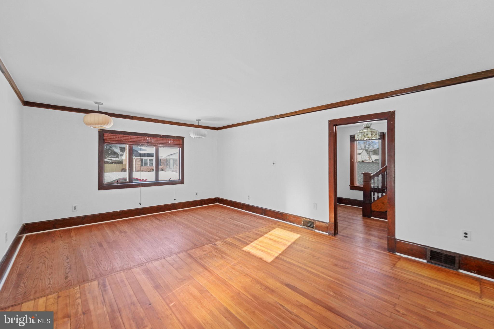 200 Union Street Salem, NJ 08079 - Photo 18 of 43 a view of an empty room with wooden floor
