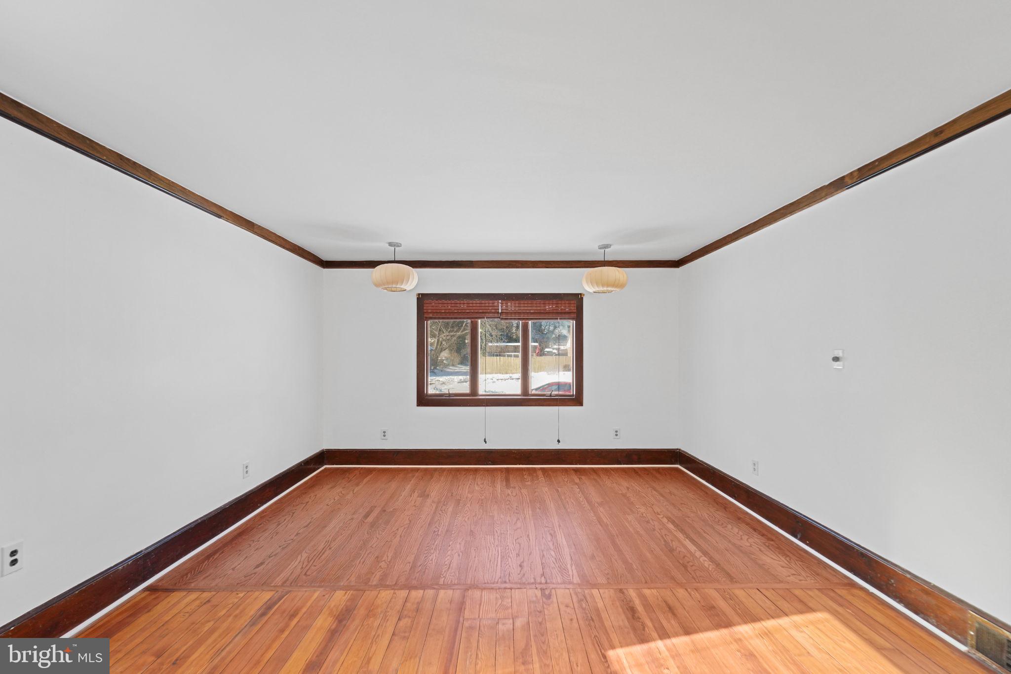 200 Union Street Salem, NJ 08079 - Photo 19 of 43 a view of empty room with wooden floor